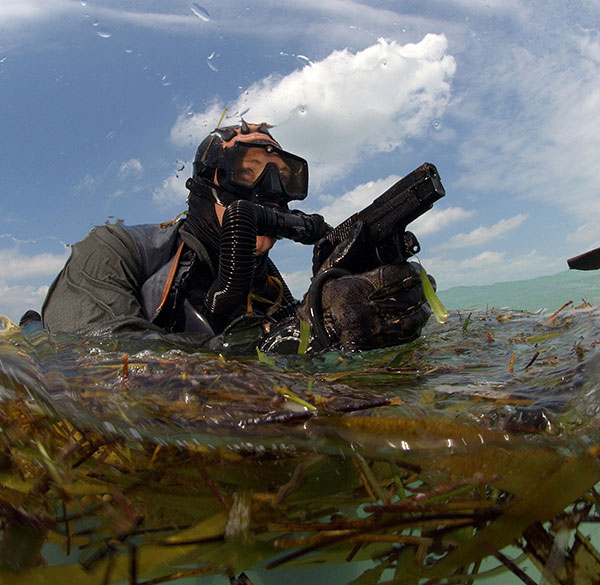 navy seal diver armed with pistol