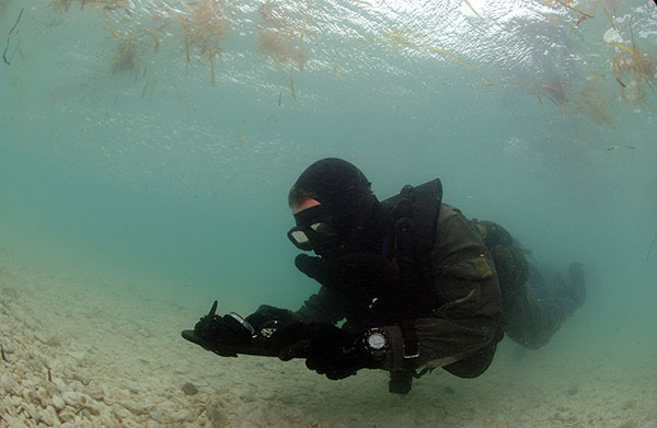 navy seal diver armed with pistol