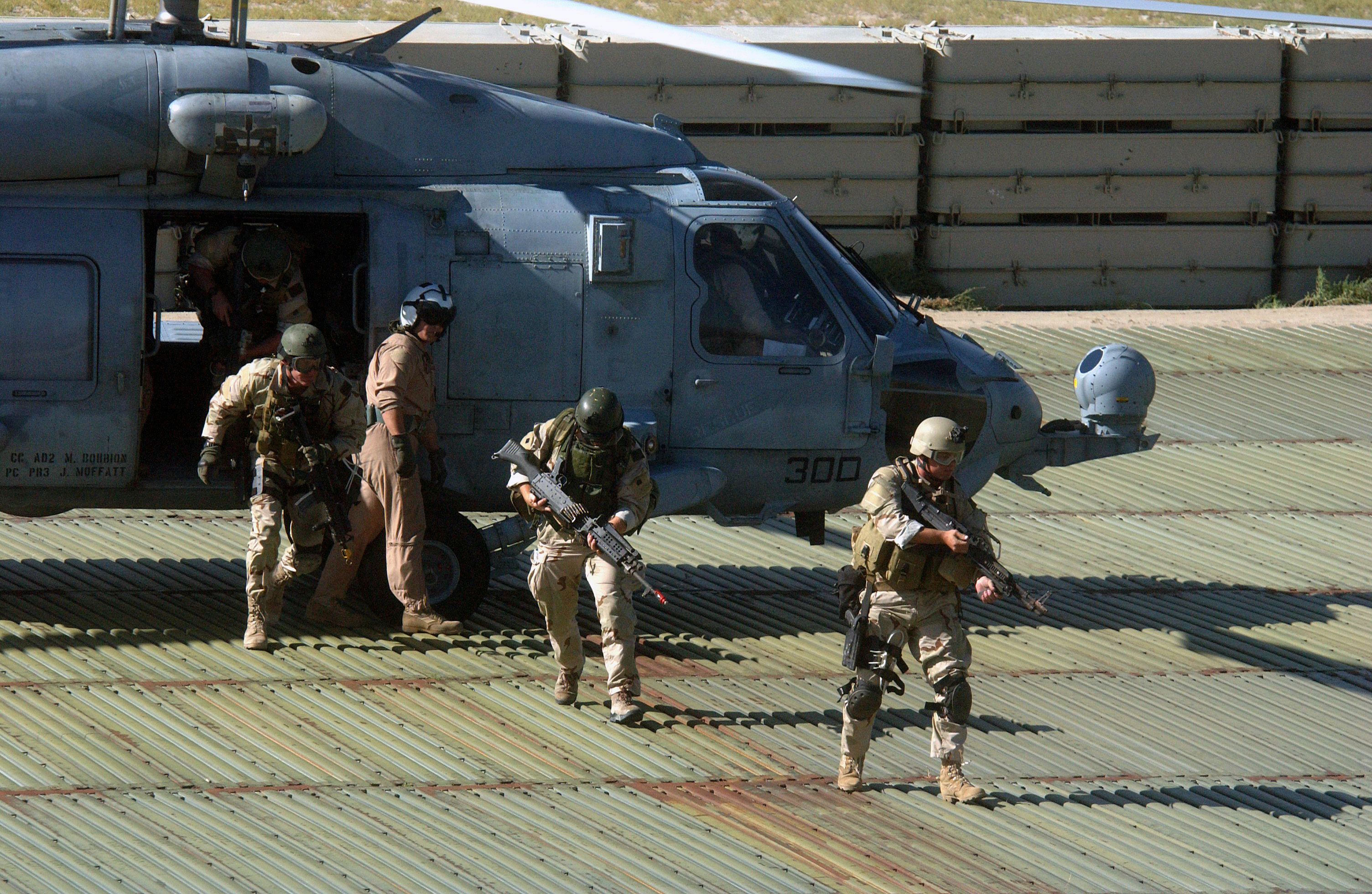 SEALs Disembarking From Seahawk Helicopter - Photo