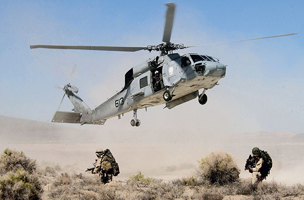 SEALs guarding Seahawk takeoff