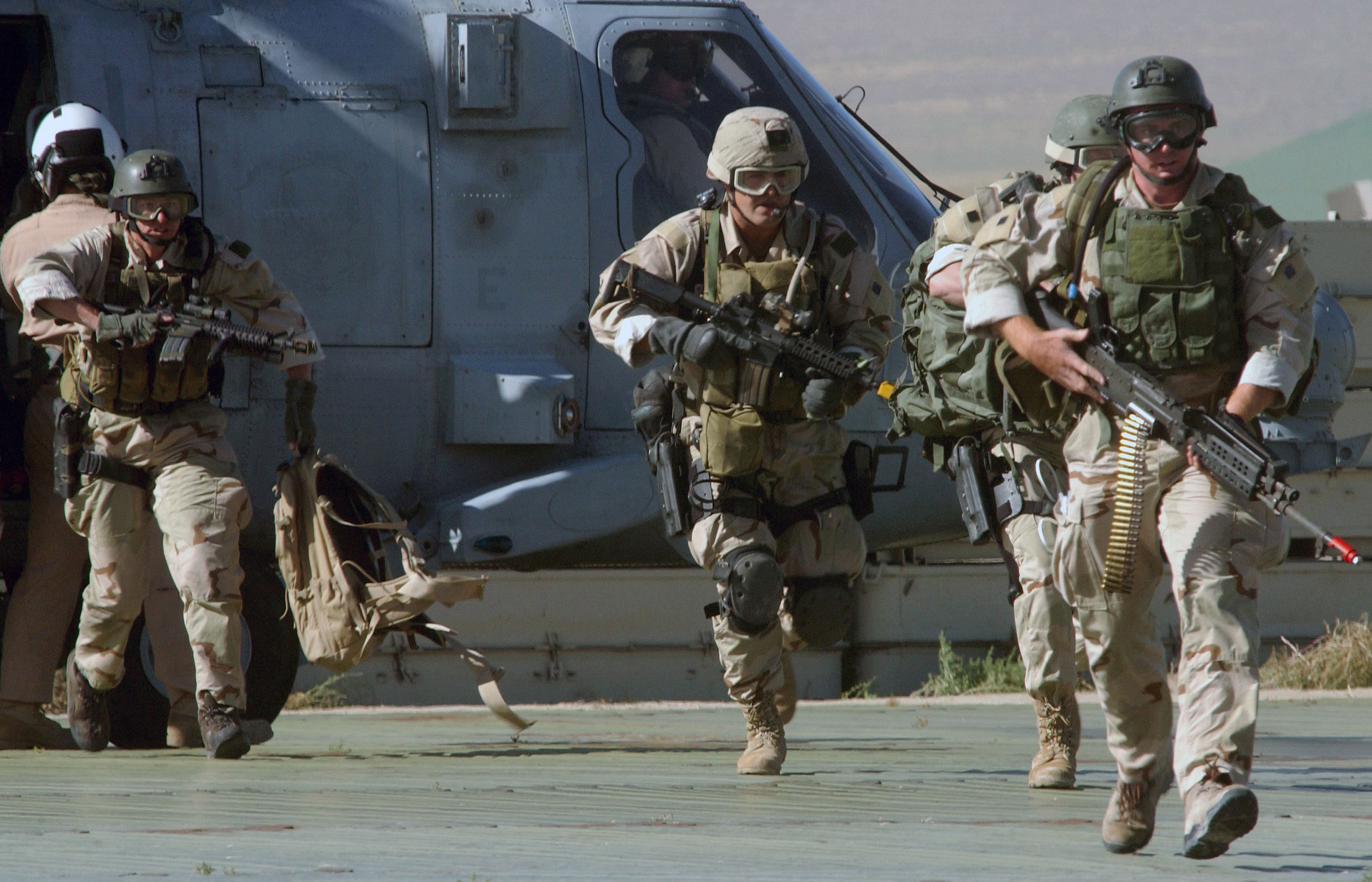 SEALs Disembarking From Seahawk Helicopter - Photo