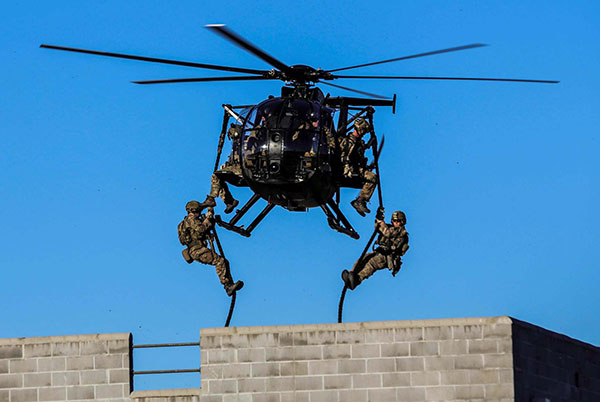 mh-6m little bird helicopter deploying Army Rangers