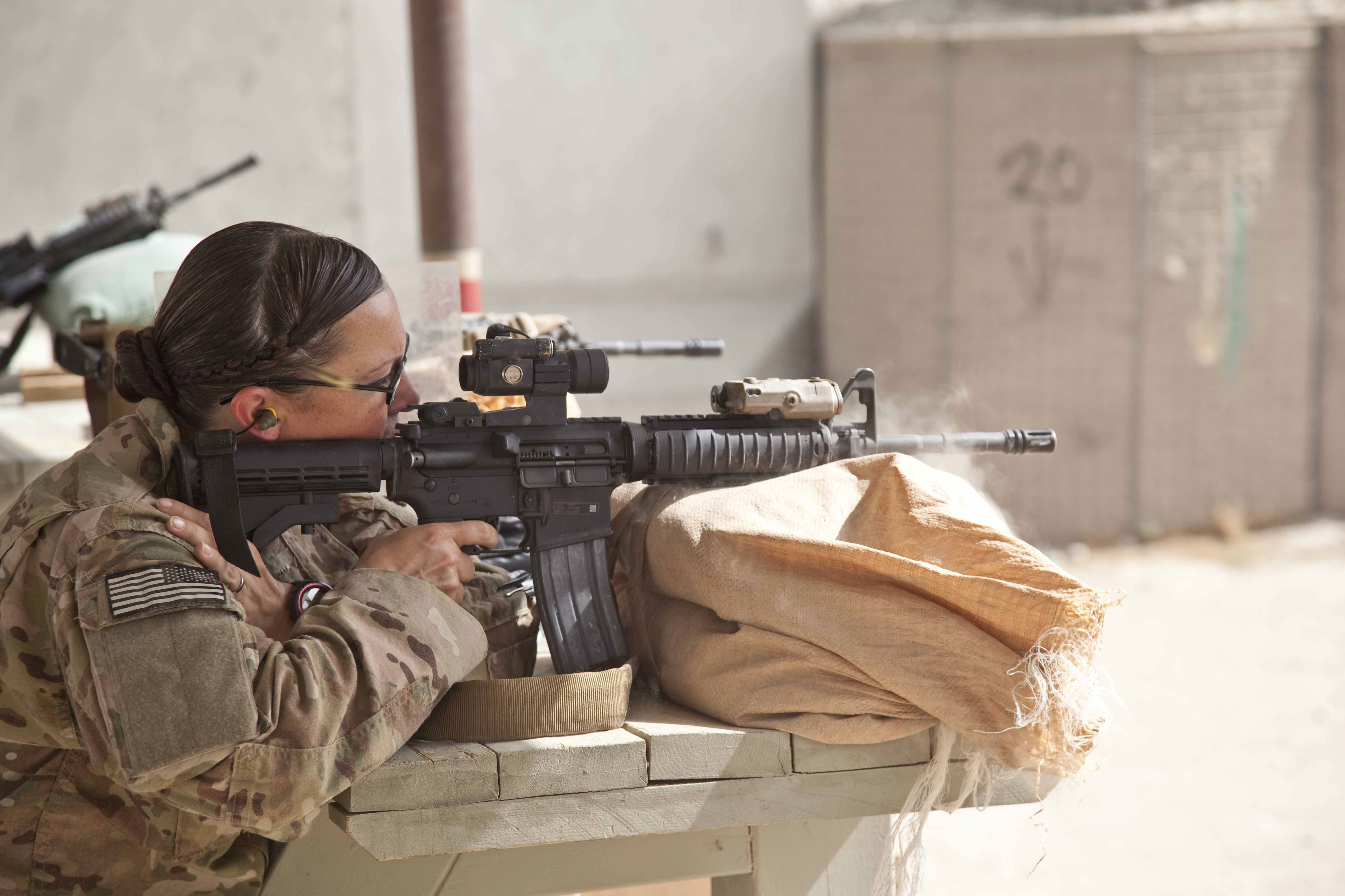 Photo of a U.S. Army Cultural Support Team (CST) firing a M4a1 carbine - fi...